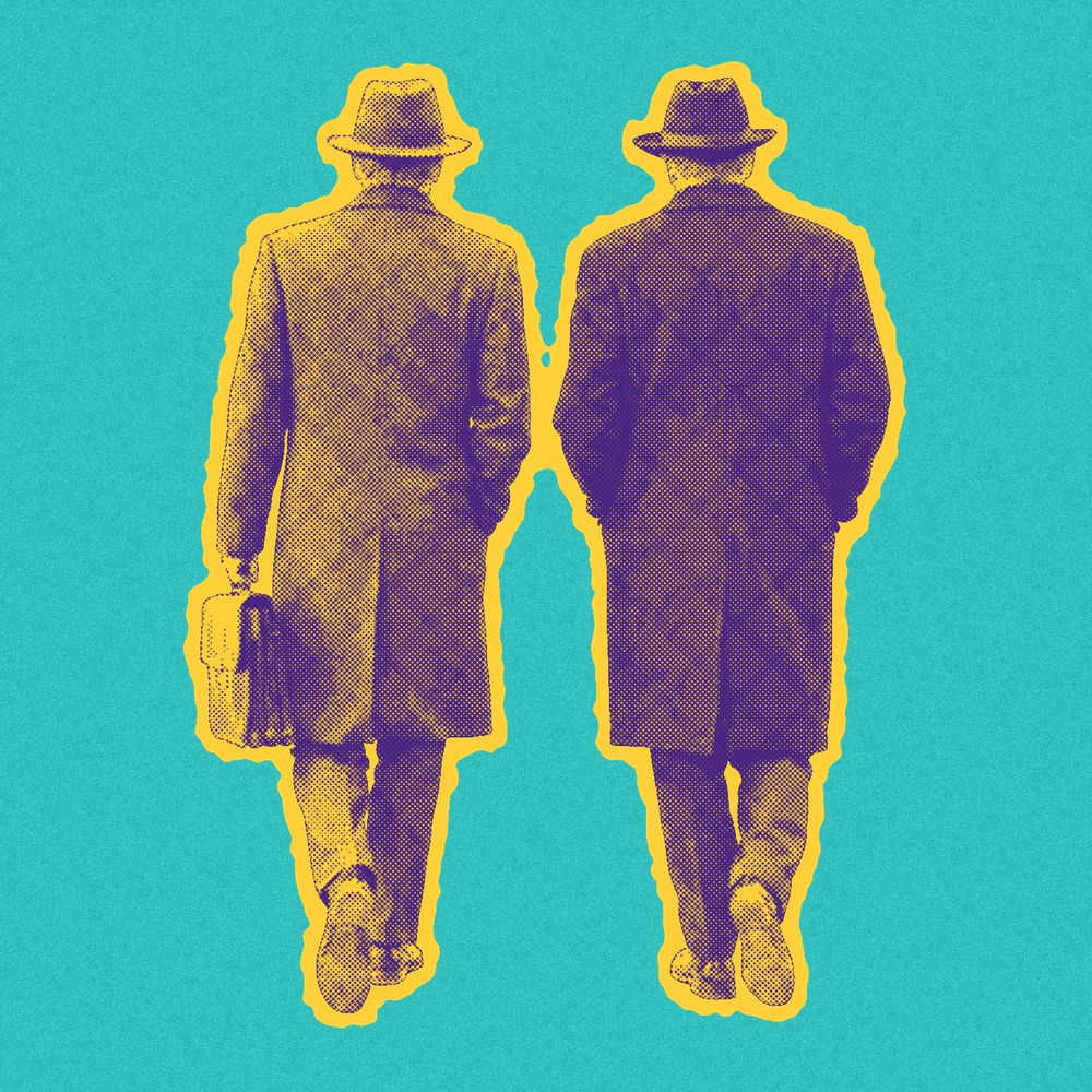 Newsprint cut-out of two men in overcoats and hats walking away.